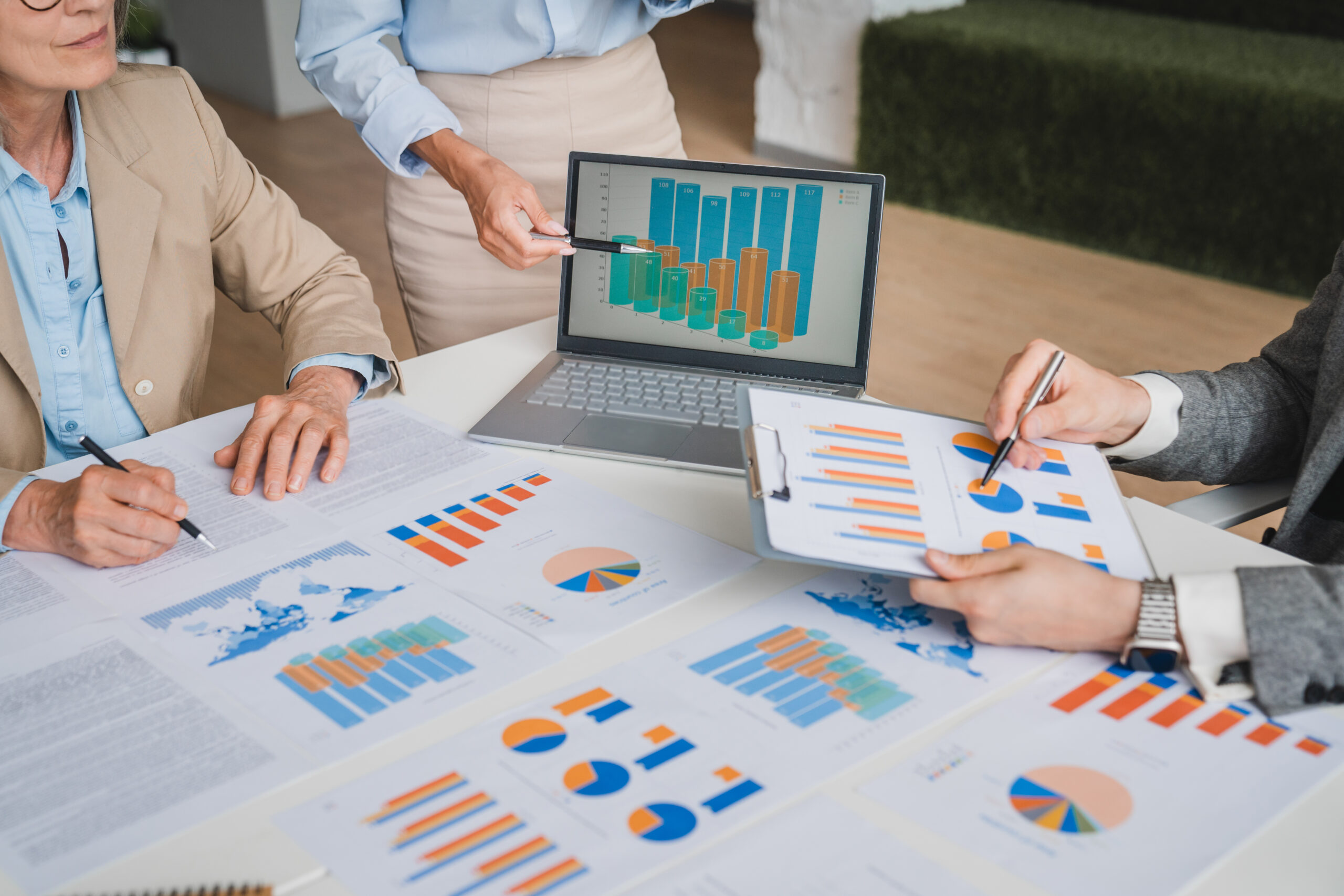 business team analyzing graphs and charts in a mee 2025 05 21 17 47 11 utc scaled.jpg
